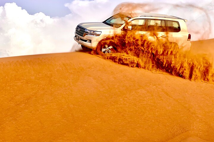 Experience the excitement of dune bashing through stunning red sands feeling the rush as the 4x4 conquers the wild desert landscape. A true adventure awaits in Lahbab Dubai!